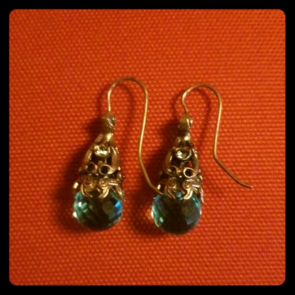Silver earrings,gold overplayed